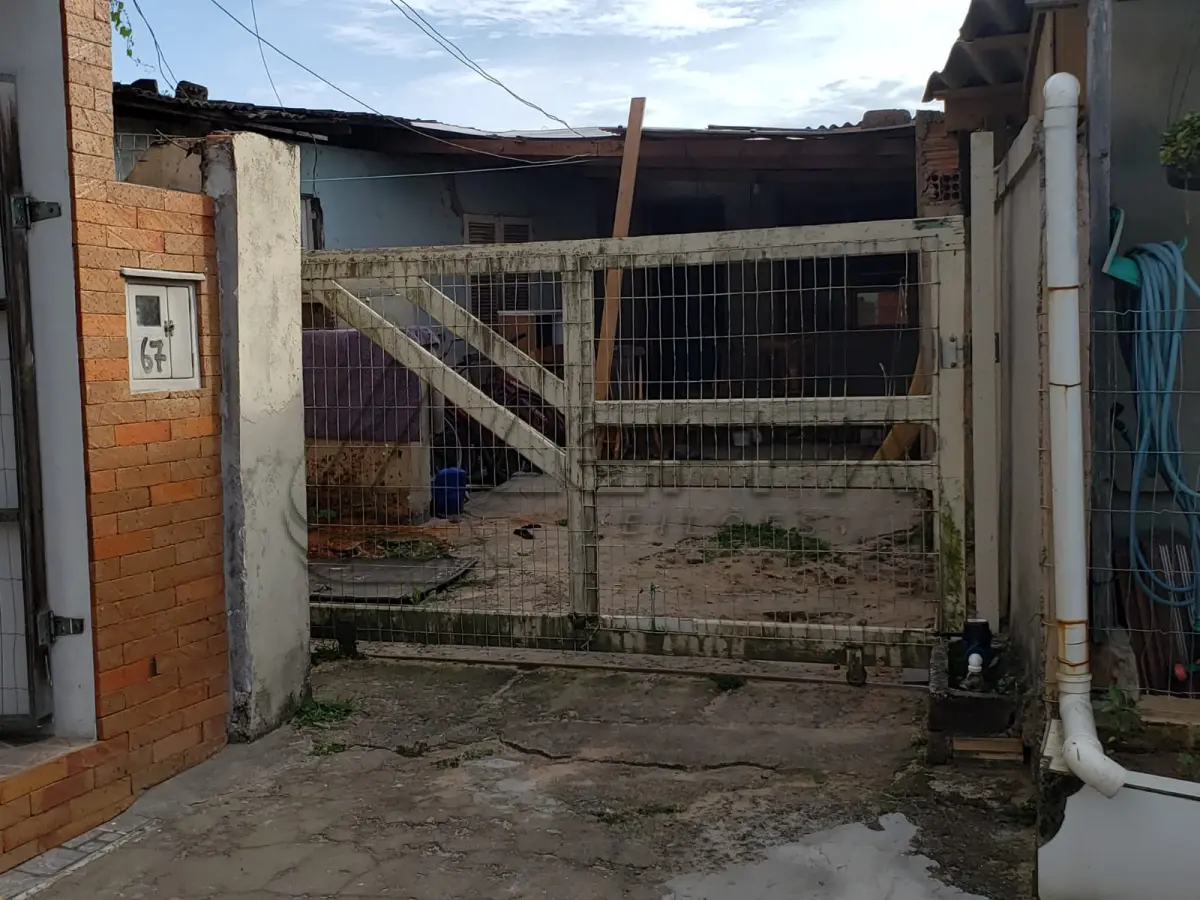 LOTE 001 - Terreno Urbano, com benfeitorias, localizado na rua Feliz, numero 70, em Torres/RS