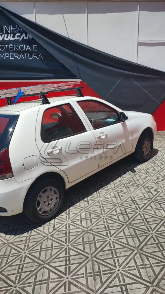 LOTE 003 - Um veículo automóvel nacional marca FIAT/PALIO FIRE ECONOMY,  cor branca, a álcool/gasolina, ano de fabricação e modelo 2012/2013, placa  MLC8C78