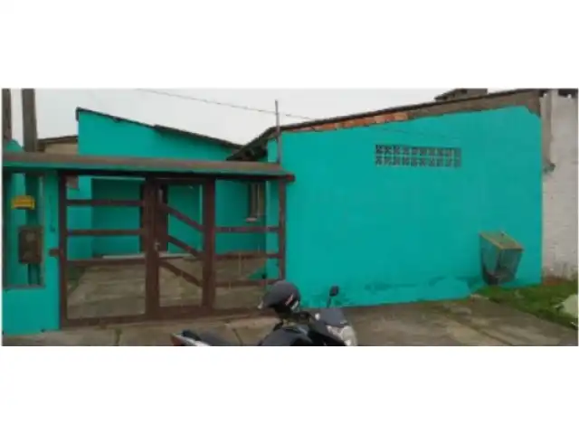 DIREITOS E AÇÕES DE UM TERRENO URBANO, COM BENFEITORIAS, SITUADO NO LUGAR DENOMINADO ZONA NOVA SUL, NA CIDADE DE TRAMANDAÍ/RS