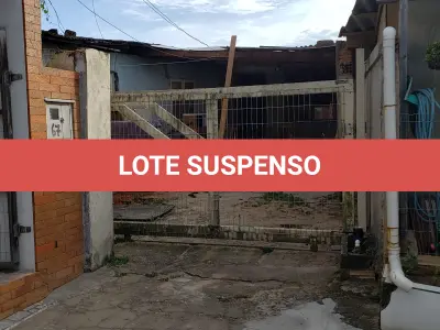 LOTE 001 - Terreno Urbano, com benfeitorias, localizado na rua Feliz, numero 70, em Torres/RS