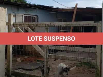 LOTE 001 - Terreno Urbano, com benfeitorias, localizado na rua Feliz, numero 70, em Torres/RS