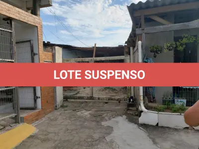 LOTE 001 - Terreno Urbano, com benfeitorias, localizado na rua Feliz, numero 70, em Torres/RS