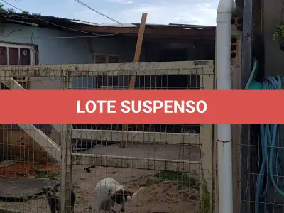 LOTE 001 - Terreno Urbano, com benfeitorias, localizado na rua Feliz, numero 70, em Torres/RS
