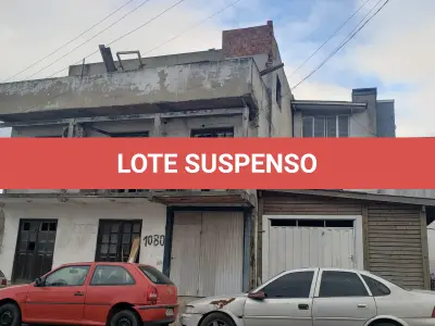 LOTE 001 - UM TERRENO URBANO, com benfeitorias, localizado na Avenida Independência, 1080, Bairro Curtume, na Cidade de Torres/RS