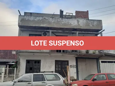 LOTE 001 - UM TERRENO URBANO, com benfeitorias, localizado na Avenida Independência, 1080, Bairro Curtume, na Cidade de Torres/RS
