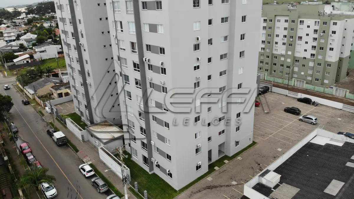 LOTE 001 - Apartamento nº 1203 e box de garagem nº 111, do Edifício Residencial Due Fratelli, em Torres/RS