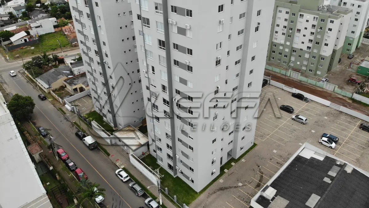 LOTE 001 - Apartamento nº 1203 e box de garagem nº 111, do Edifício Residencial Due Fratelli, em Torres/RS