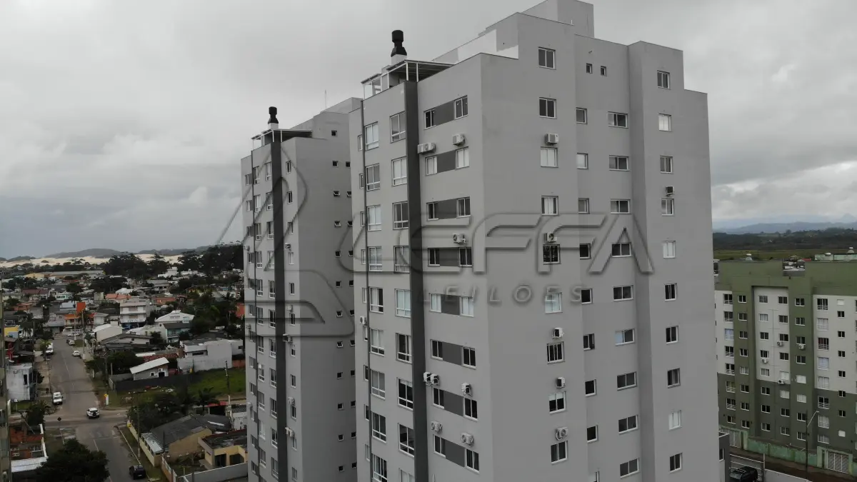 LOTE 001 - Apartamento nº 1203 e box de garagem nº 111, do Edifício Residencial Due Fratelli, em Torres/RS