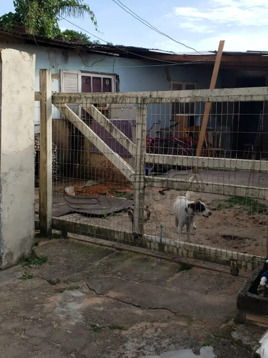 LOTE 001 - Terreno Urbano, com benfeitorias, localizado na rua Feliz, numero 70, em Torres/RS