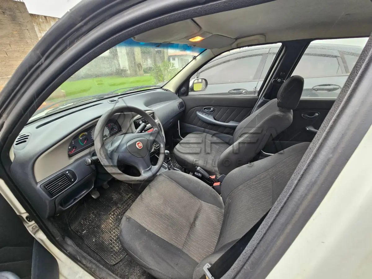 LOTE 003 - Um veículo automóvel nacional marca FIAT/PALIO FIRE ECONOMY,  cor branca, a álcool/gasolina, ano de fabricação e modelo 2012/2013, placa  MLC8C78