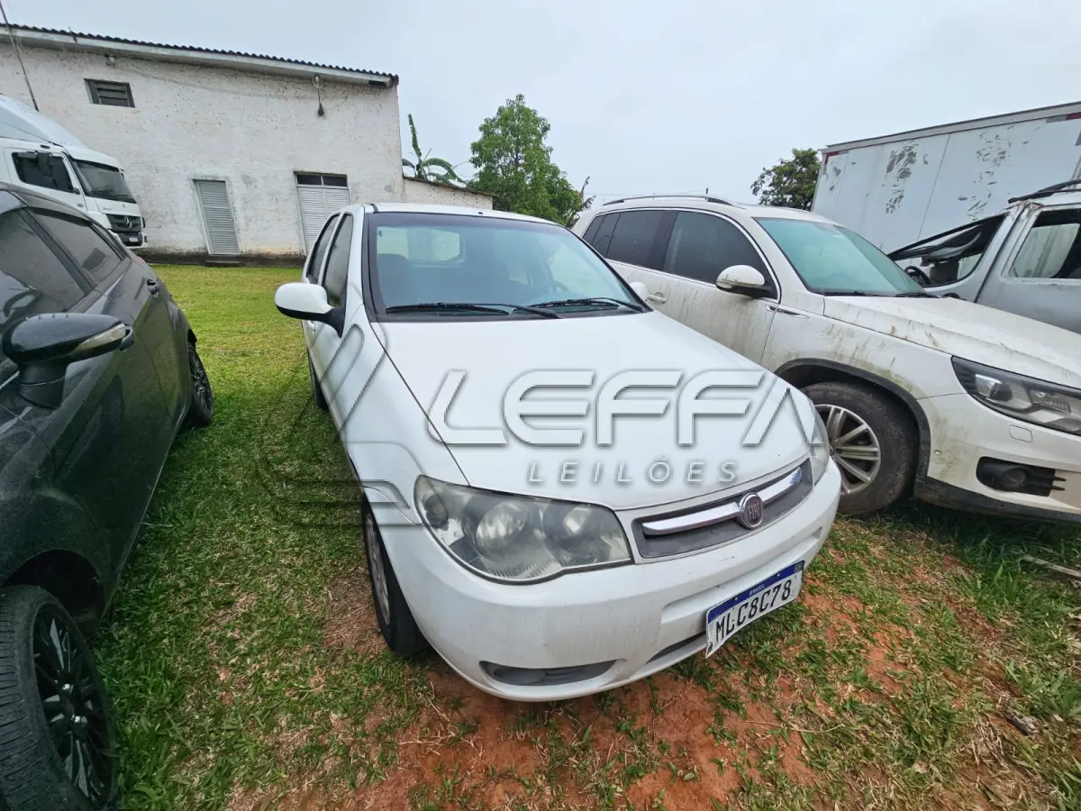 LOTE 003 - Um veículo automóvel nacional marca FIAT/PALIO FIRE ECONOMY,  cor branca, a álcool/gasolina, ano de fabricação e modelo 2012/2013, placa  MLC8C78