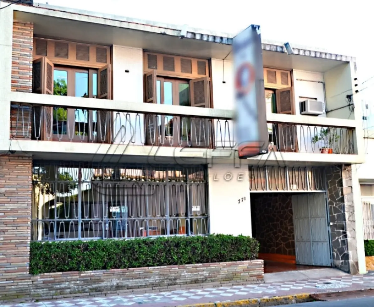 LOTE 001 - UM TERRENO URBANO CENTRAL, com a área aproximada de 419,05m², contendo construído um prédio de alvenaria de dois pavimentos, em PELOTAS/RS