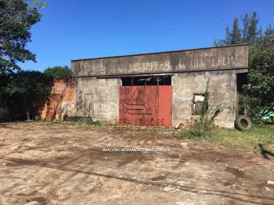 LOTE 001 - TERRENO URBANO COM BENFEITORIAS NA VILA SÃO JOÃO EM TORRES/RS