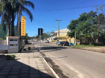 LOTE 001 - TERRENO URBANO COM BENFEITORIAS NA VILA SÃO JOÃO EM TORRES/RS